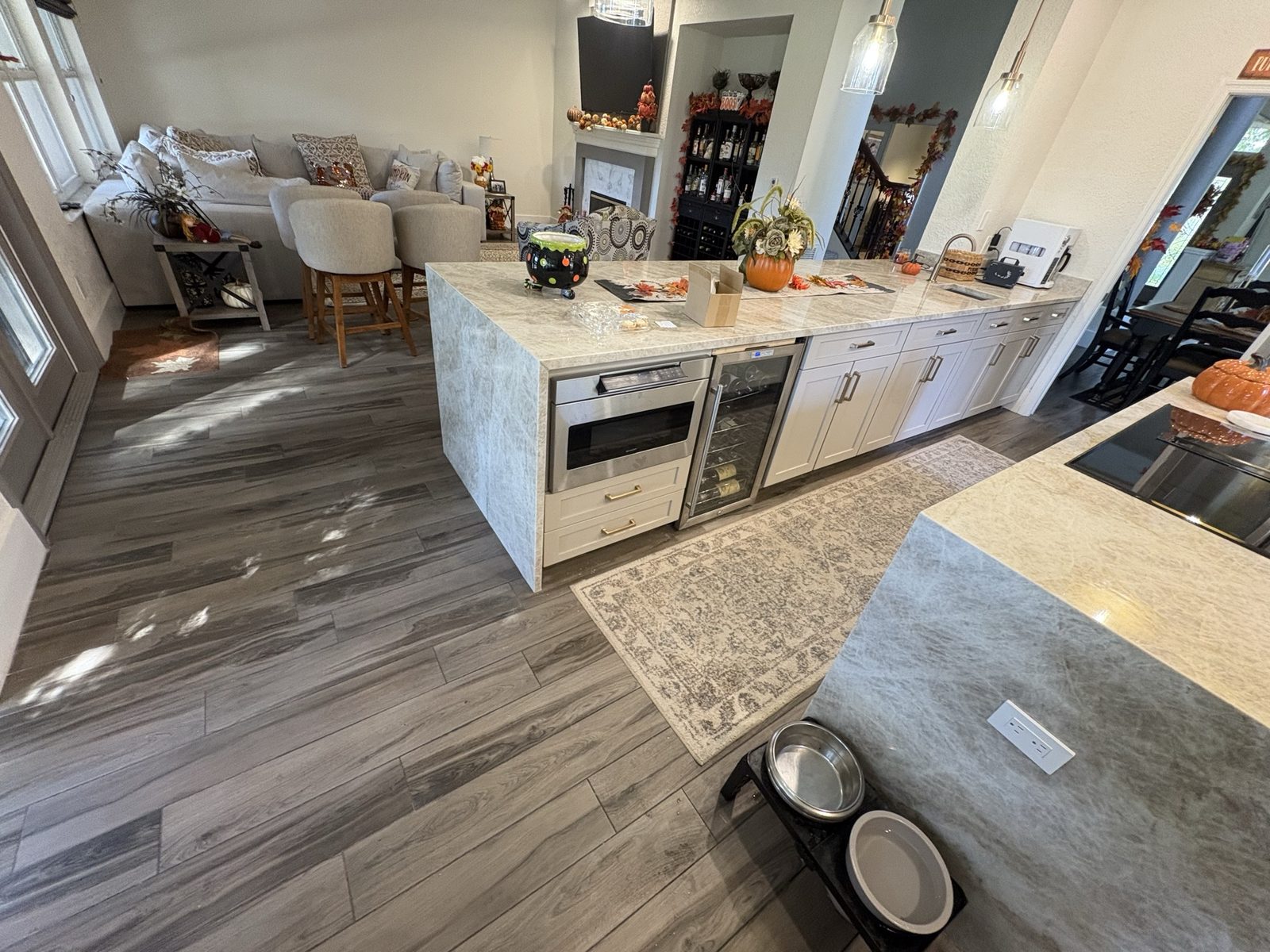 After: Cotton White island with waterfall countertops and refaced cabinets