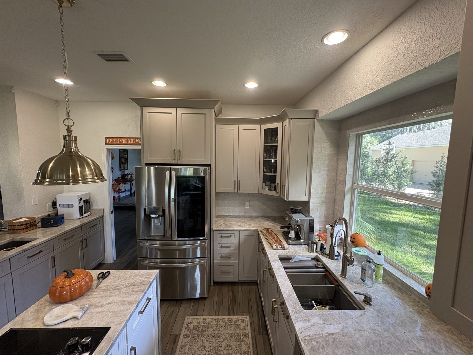 After: refaced sink wall cabinets in Perfect Greige