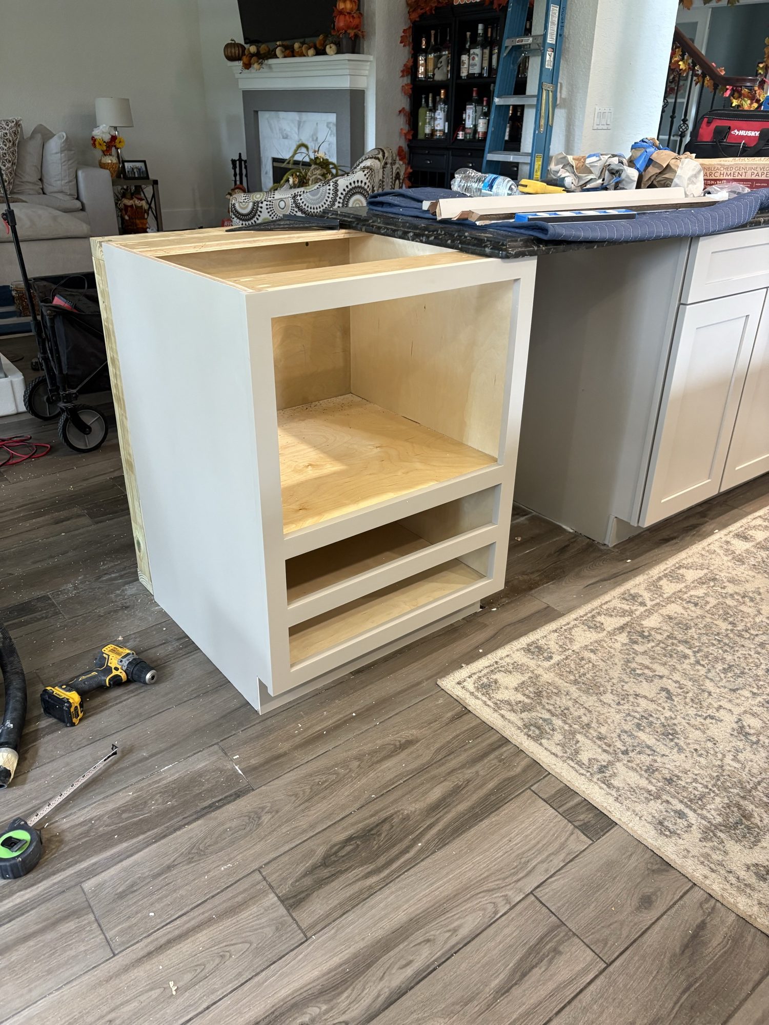 New base cabinet set into the island on site
